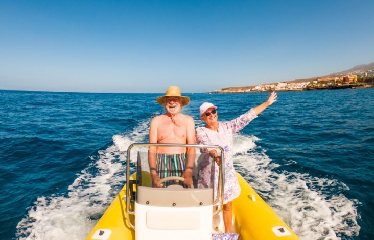 Two elderly people stood on a jetboard