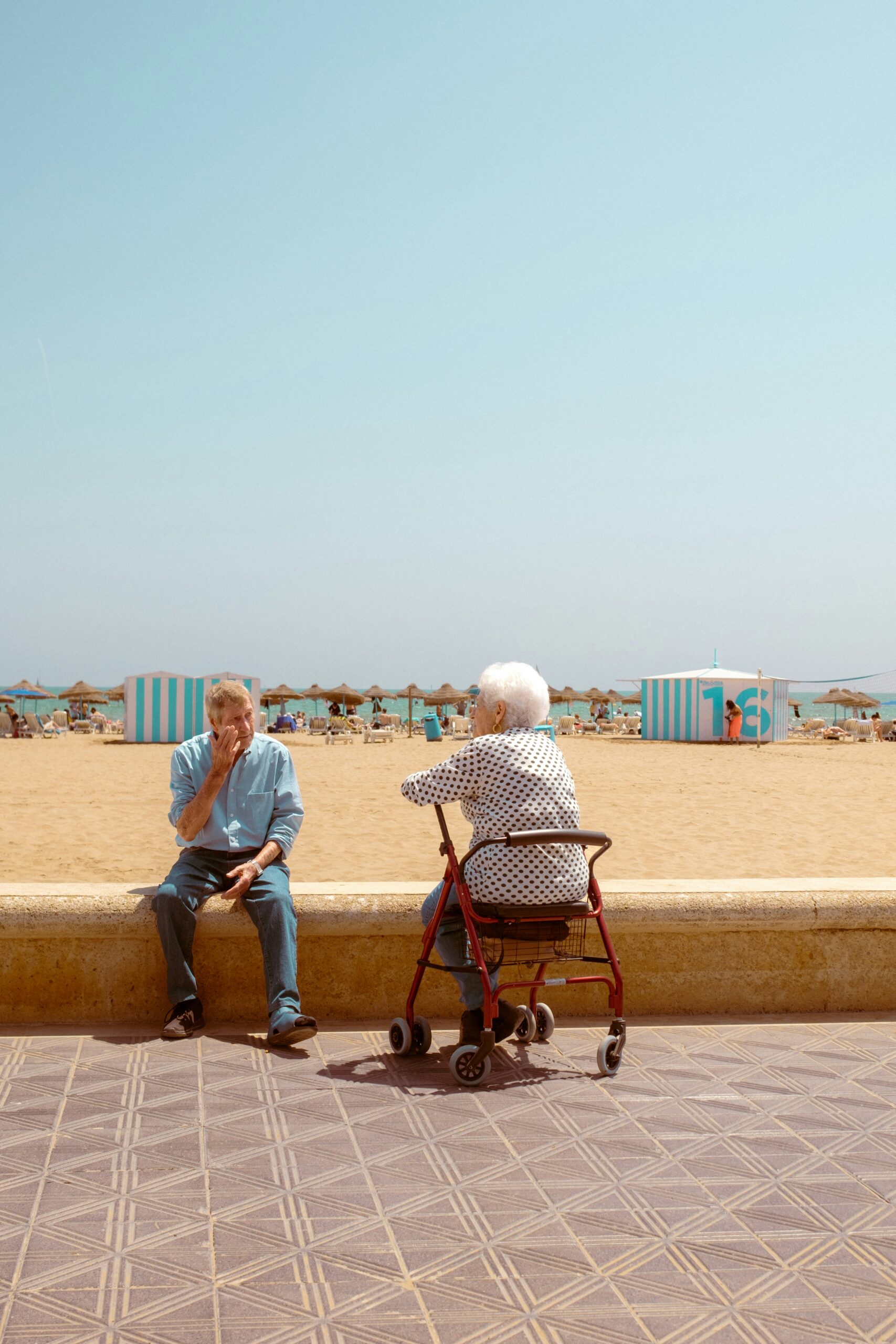 two persons sitting and talking